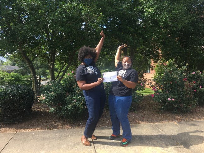 College Factory reps pose for the camera, excited about our donation!